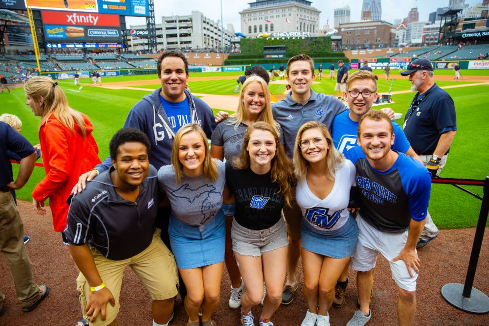 Group photo of 9 at Comerica Park